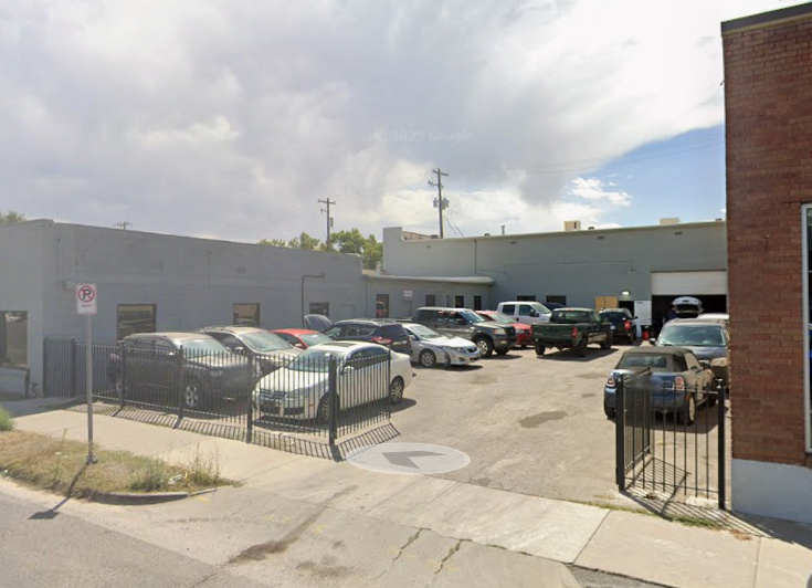 The Los Oviedo Garage and Sales lot on South State Street in Salt Lake City, with vehicles parked in front of the service building